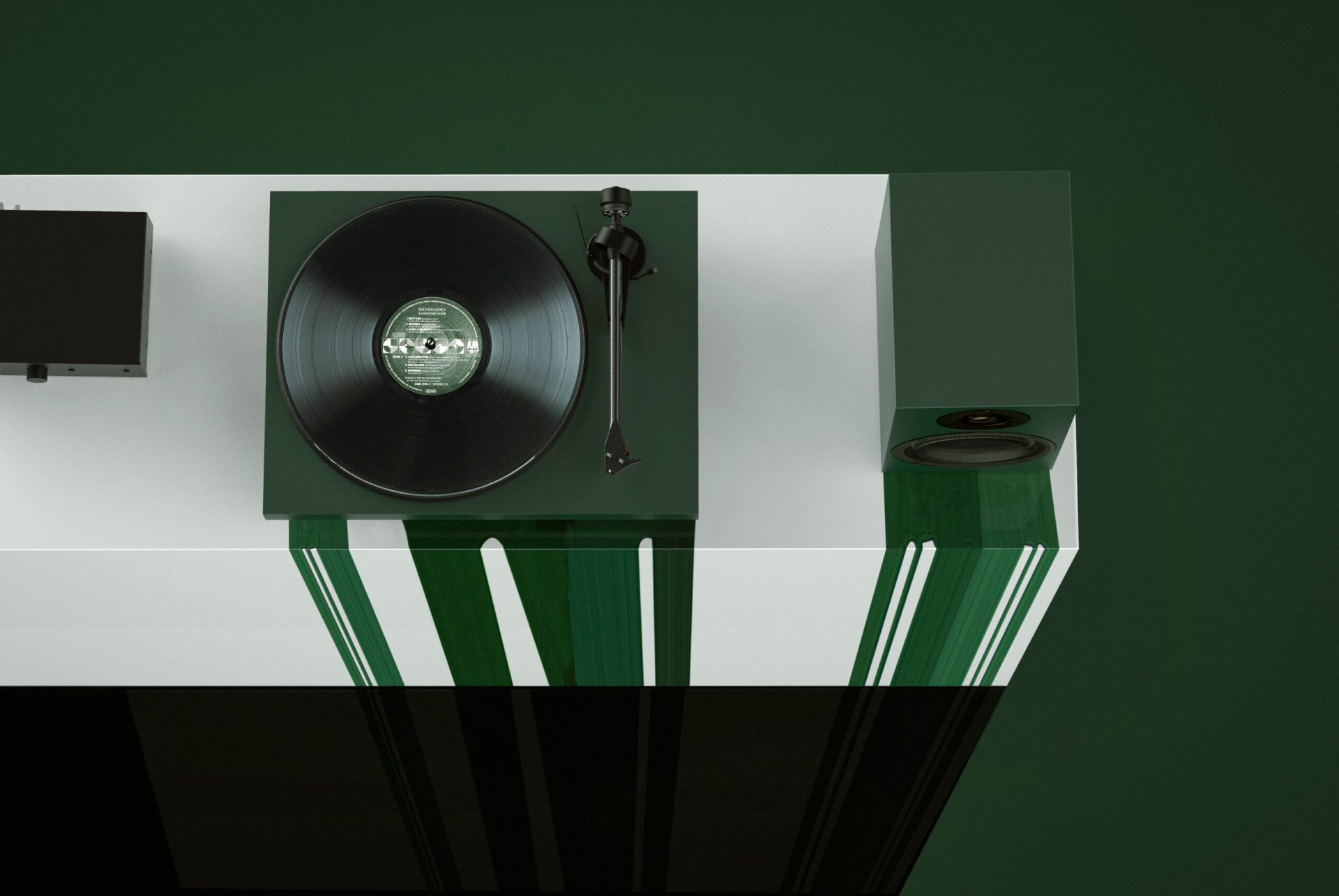 Pro-Ject Colorful Audio System in Satin Fir Green colorway placed on a white box. Green paint flows down the box.