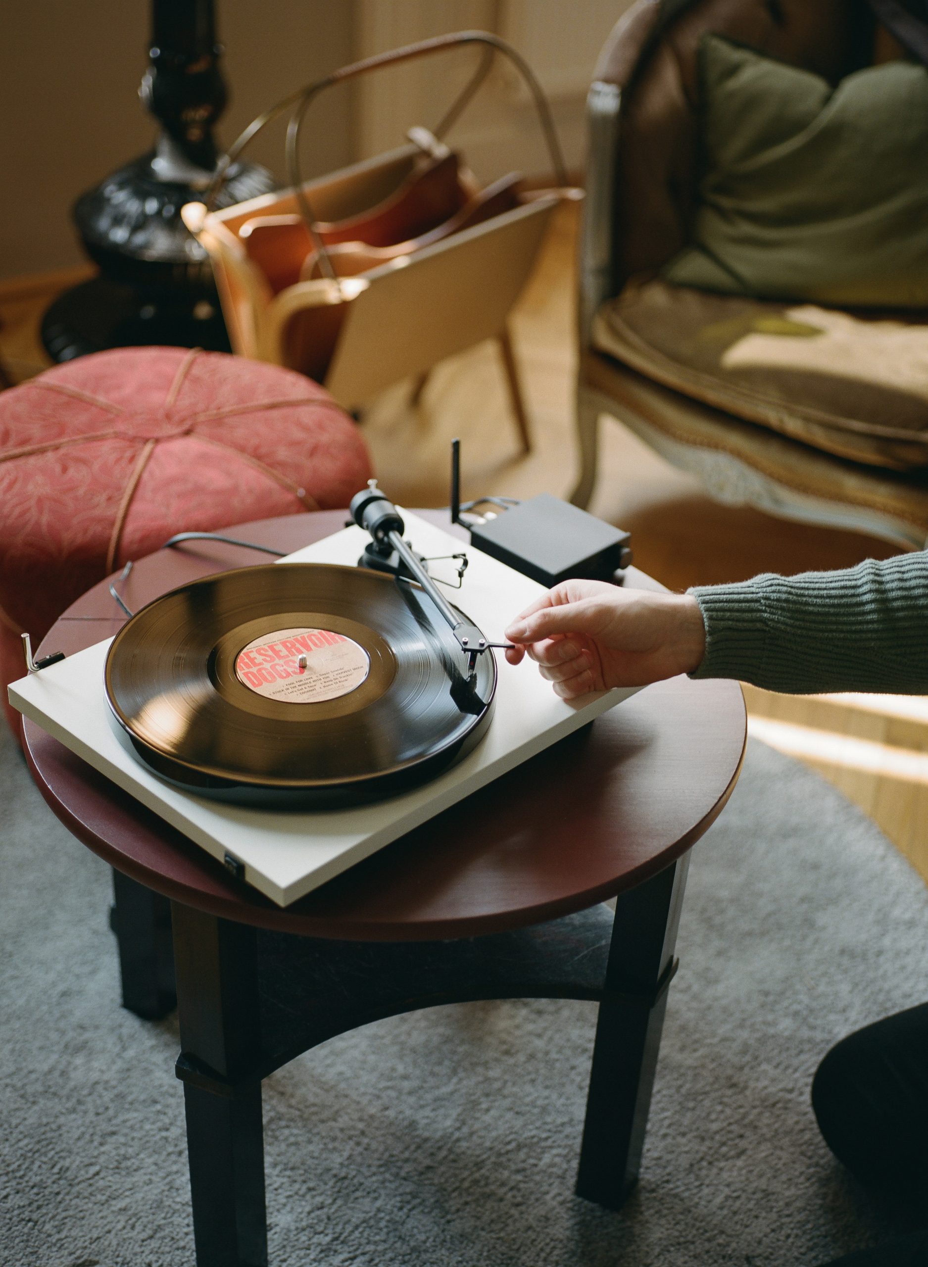Playing Reservoir Dogs from Various on the E1 Record player placed on a wooden table