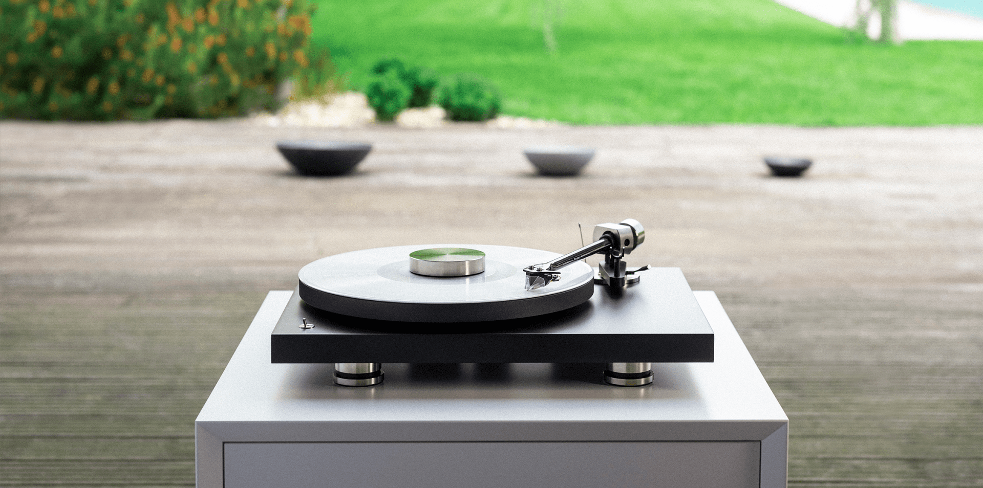 Pro-Ject Debut Pro 2 placed on a white table in the garden